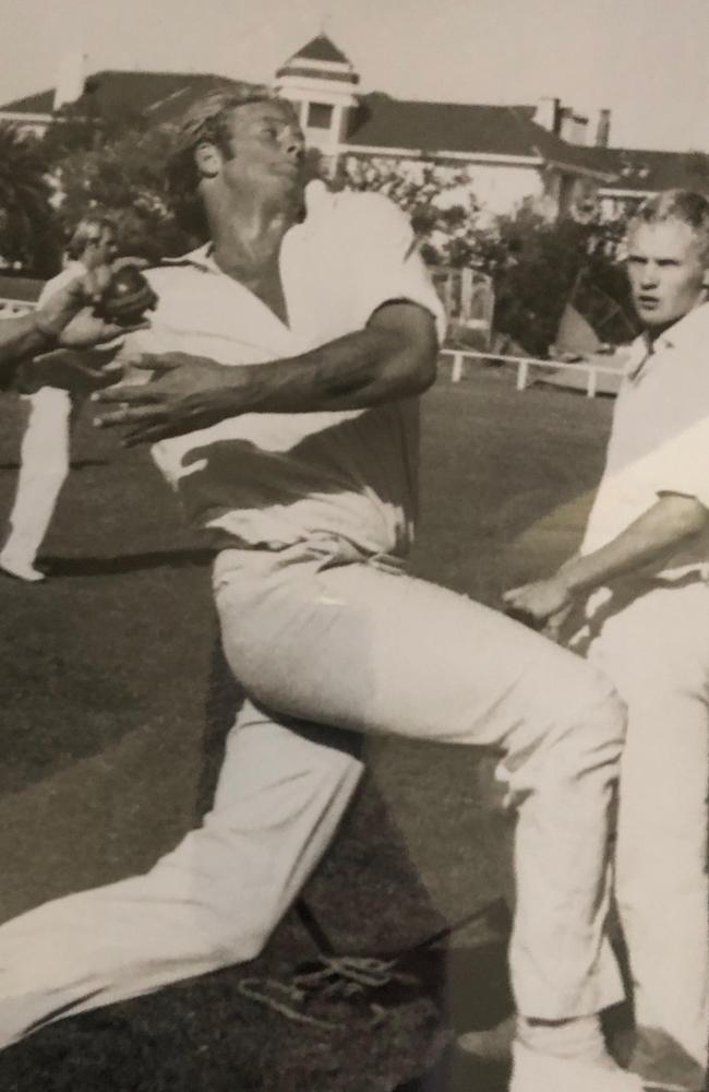 Nigel Murch tearing in at state practice, a young Rodney Hogg looking on.