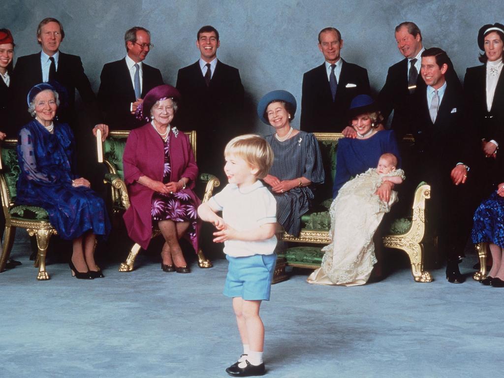 The Queen beams as Prince William steals the show at Prince Harry’s christening in December 1984. Picture: Lord Snowdon via Anwar Hussein/Getty Images