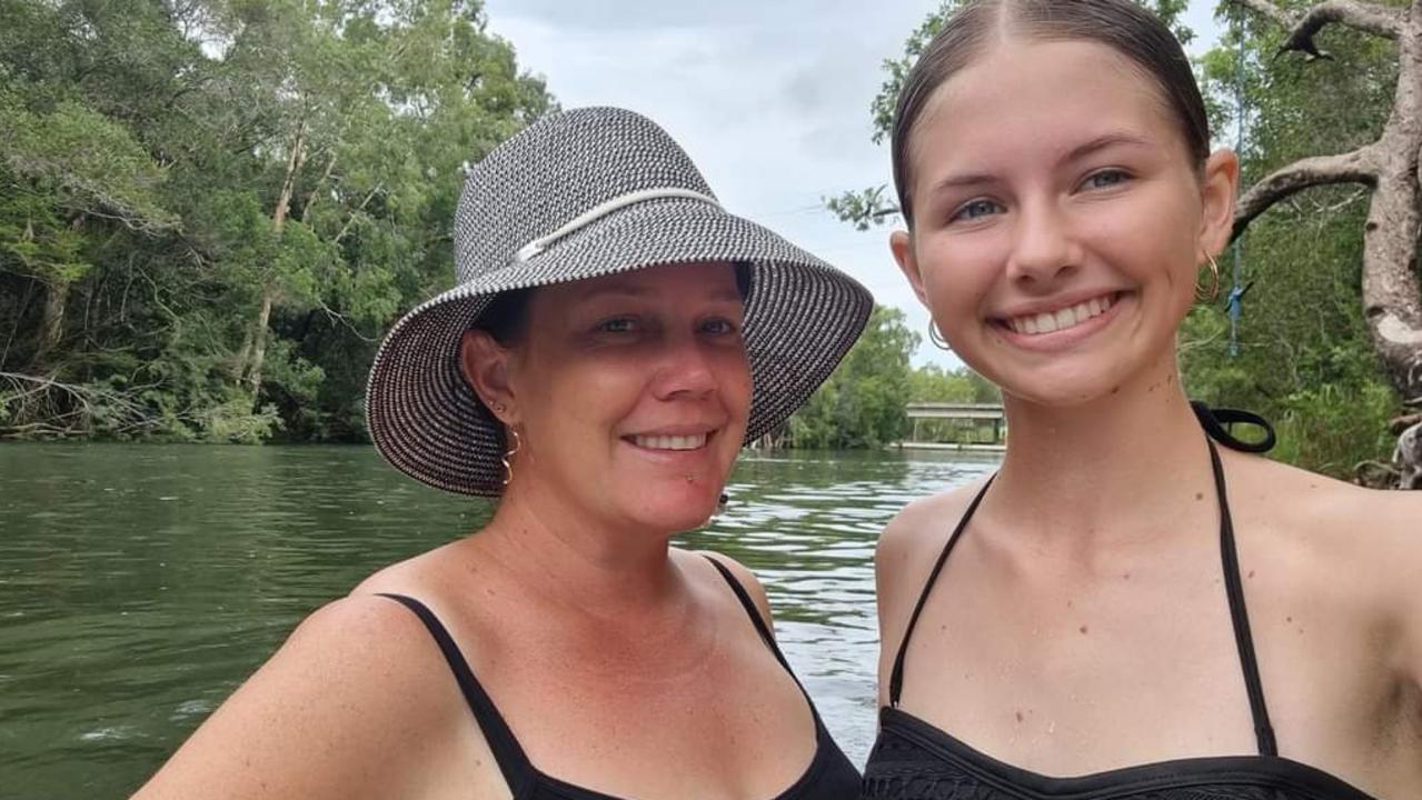 Alicia May, mother of five children aged seven to 16, with daughter Savannah Wallace, 15, at the popular Rollingstone Creek swimming hole. Picture: Supplied