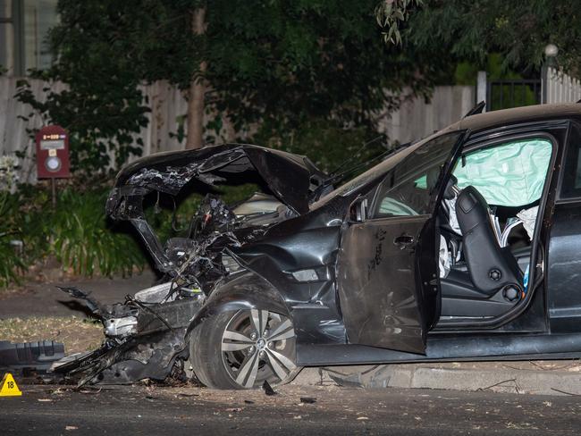 The crash ripped apart the front of a black Holden ute. Picture: Jason Edwards