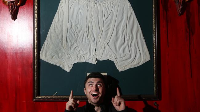 Luke Newman with Queen Victoria's underwear. Picture Glenn Hampson