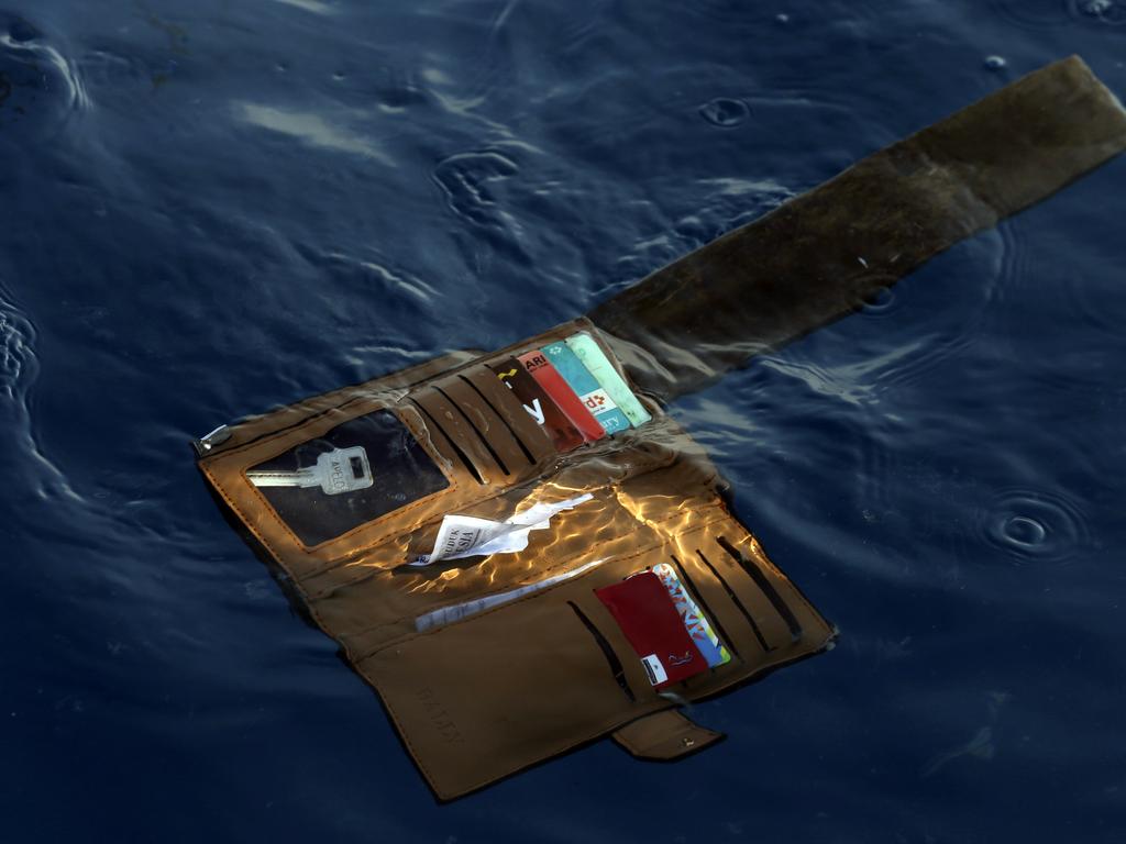 A wallet belonging to a victim of the Lion Air passenger jet that crashed floats in the waters of Ujung Karawang, West Java, Indonesia. Picture: AP