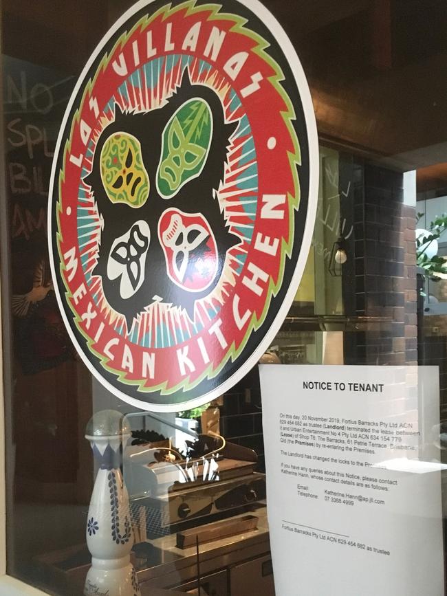 An eviction notice sits in the window of Los Villanos Mexican Kitchen at The Barracks on Petrie Terrace. Pic: Darren Cartwright