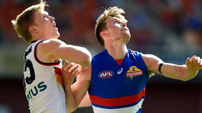 Fischer McAsey tussles with Western Bulldog Ryan Gardener. Picture: AFL Photos/Getty Images