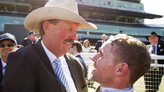 Then trainer Greg Bennett celebrates with jockey Tommy Berry after Clearly Innocent won the 2016 Country Championships Final. Picture: Jenny Evans