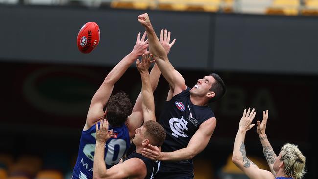 Jacob Weitering soars above a pack to spoil against North Melbourne.