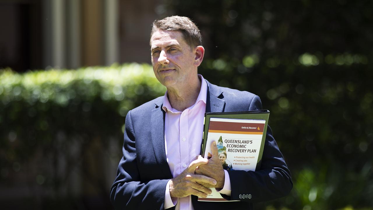 Treasurer Cameron Dick holding the economic recovery plan in November 2020. (News Corp/Attila Csaszar)