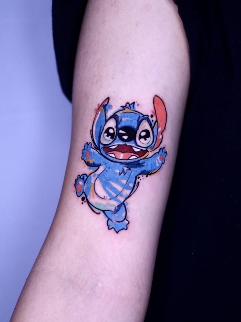 She specialises in coloured tattoos featuring characters such as Stitch.