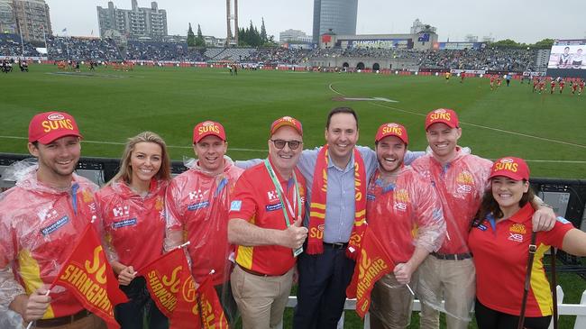 Federal Minister for Trade, Tourism &amp; Investment Steven Ciobo at the AFL match in Shanghai with Gold Coast Suns Chairman Tony Cochrane and Suns fans from left: Kiel Sinclair, Giulia Badalotti, Darryl Dyson, Todd Matheson, Flynn McFarlane and Georgia Linton. Picture: DFAT/Chris Crerar