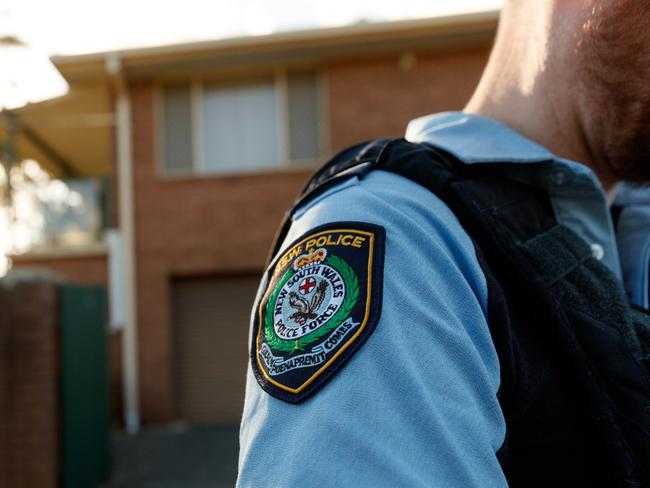 DAILY TELEGRAPH. Embed with police on Operation Amarok regional domestic violence response on the NSW Mid North Coast. In this picture, police conduct an AVO compliance check at an address in Kempsey. GENERIC police badge patch. Wednesday 15/05/2024. Picture by Max Mason-Hubers Police knock on the door of a Kempsey home in order to do an compliance check. No one is home and we leave.