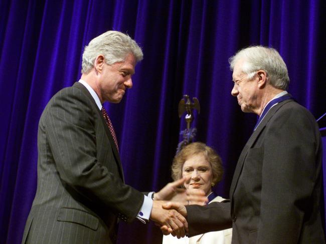 Then president Bill Clinton awards Jimmy Carter and his wife Rosalynn Carter the Presidential Medal of Freedom. Picture: AP