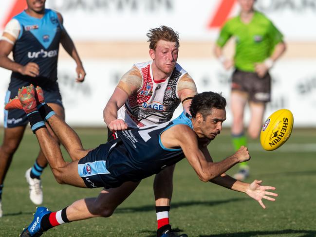 Round 2 NTFL: Darwin Buffaloes v Southern Districts from TIO Stadium. Kevin Maroney of the Buffaloes handballs under pressure. Picture: Che Chorley