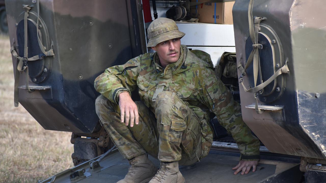 A soldier in an armoured personnel carriers at the Shoalwater Bay Training Area.