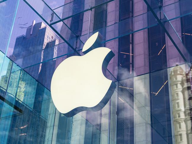 New York City, United States - September 27, 2016: Glass building of the Apple Store with huge Apple Logo at 5th Avenue near Central Park. The store is designed as the exterior glass box above the underground display room