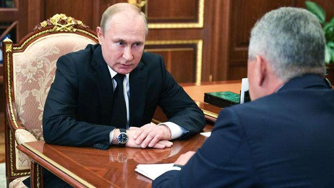 Russian President Vladimir Putin meets with Russian Defence Minister Sergei Shoigu in Moscow. Picture: AFP