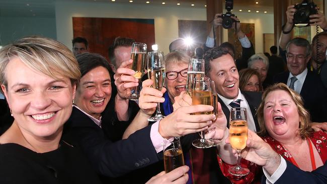 Tanya Plibersek, Penny Wong and Magda Szubanski after the Same Sex Marriage Bill passed in the House of Representatives Chamber, at Parliament House in Canberra.