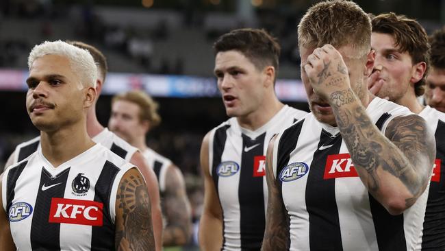 MELBOURNE, AUSTRALIA - MARCH 21: Dejected Magpies players walk from the ground after the round two AFL match between St Kilda Saints and Collingwood Magpies at Melbourne Cricket Ground, on March 21, 2024, in Melbourne, Australia. (Photo by Darrian Traynor/Getty Images)