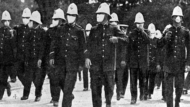 Police in masks in Sydney during the 1919 Spanish flu outbreak. Picture: The Australasian