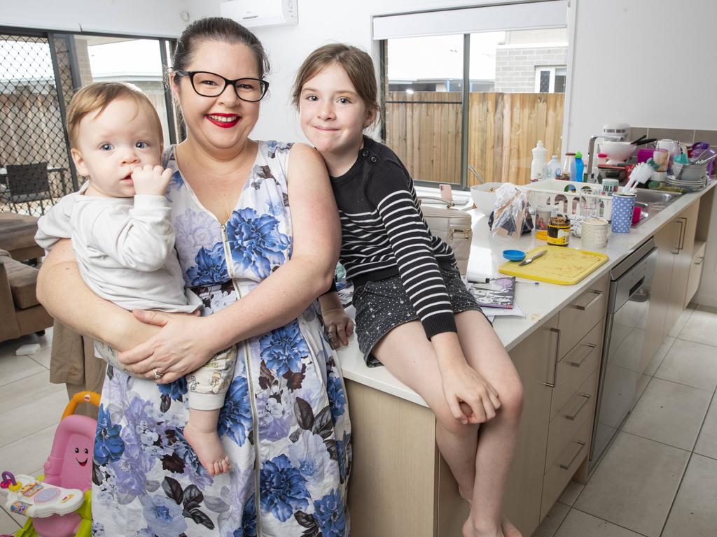 Newport mum of four Lou Smith who outsources cleaning, gardening and a virtual assistant, pictured at home with daughters Abi 14 months, and Caitlin 7. Picture Lachie Millard