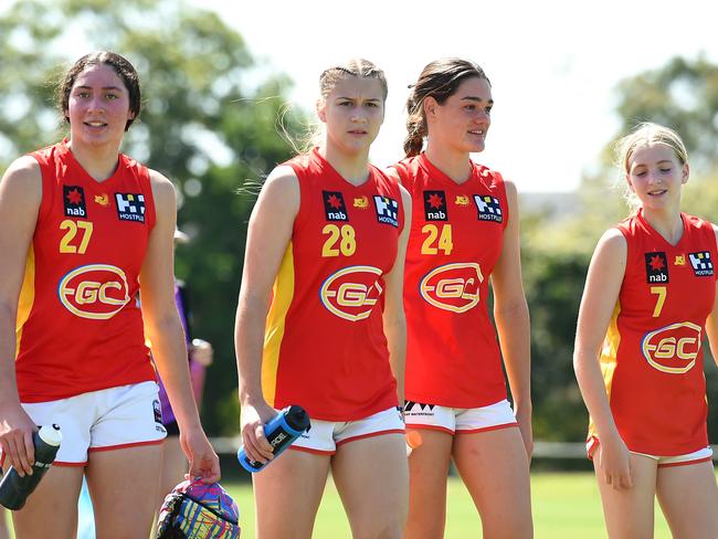 Dekota Baron, Chloe Gaunt, Georja Davies and Sunny Lappin of the Gold Coast Suns Academy Girls walk off the field after their victory during the AFL U16 Girls match between the Brisbane Lions and the Gold Coast Suns on September 19, 2022 in Sunshine Coast, Australia. Picture: Albert Perez/AFL Photos via Getty Images.