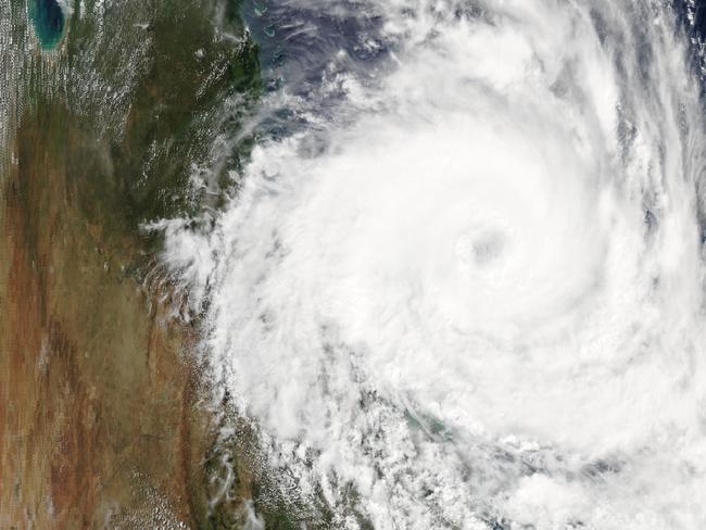 Cyclone Debbie crosses the Queensland coast. Picture: NASA/Aqua/MODIS