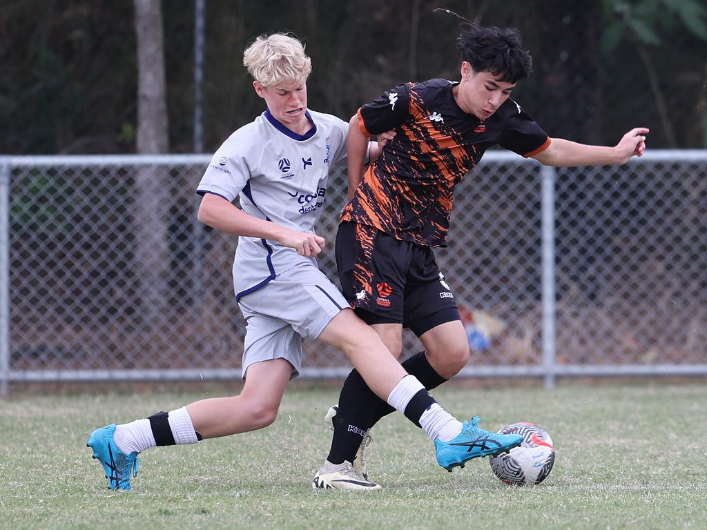 Premier Invitational Football 2024 tournament at Glennon Park Nerang. Field 2...Magic Utd (grey) V Football NT Utd. Picture Glenn Hampson