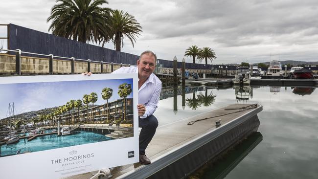 Murry Offord with a picture of the future development for Martha Cove town centre. Picture: Valeriu Campan