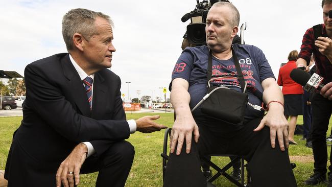 Bill Shorten speaks to cancer patient Rob Gibbs at the end of a press conference outside Casey Hospital. Picture: AAP