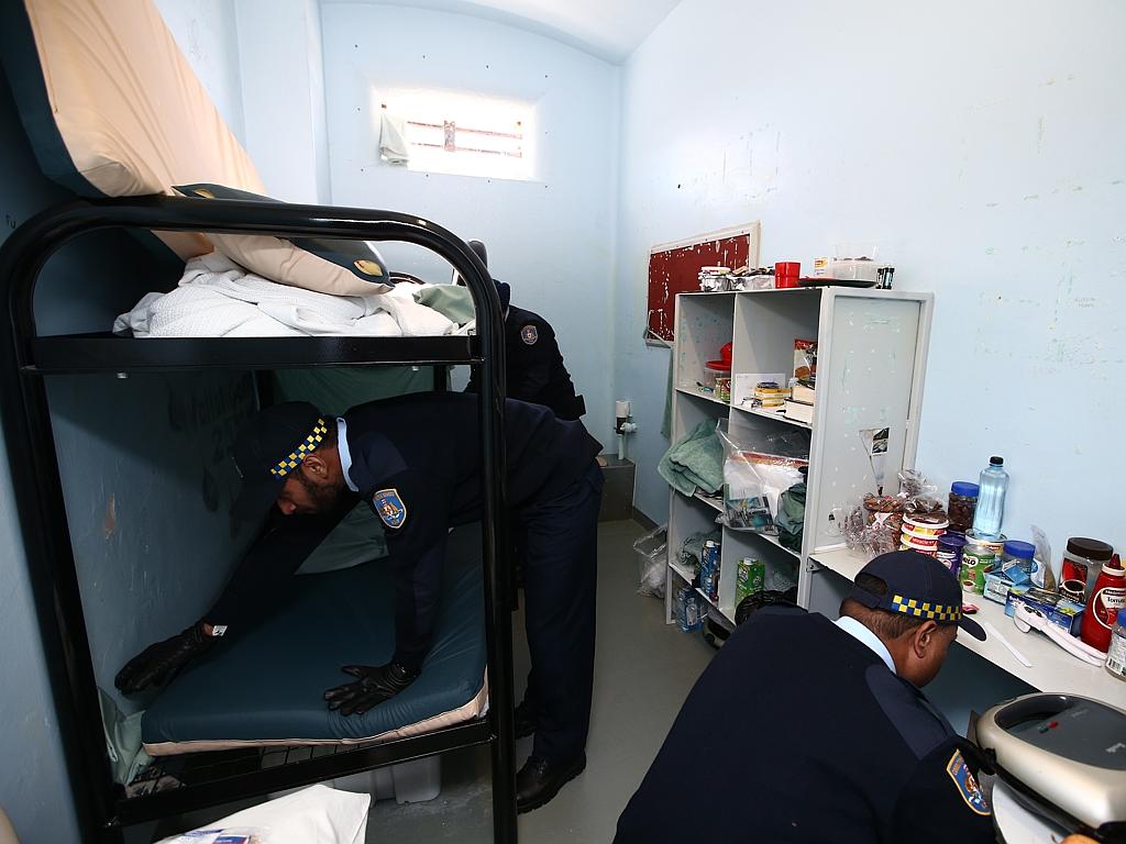 Correctional officer trainees search a cell at Long Bay. Picture: Tim Hunter