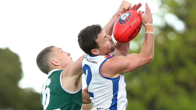 Luke Lirosi marks in front of Michael Croxford. Picture: Hamish Blair