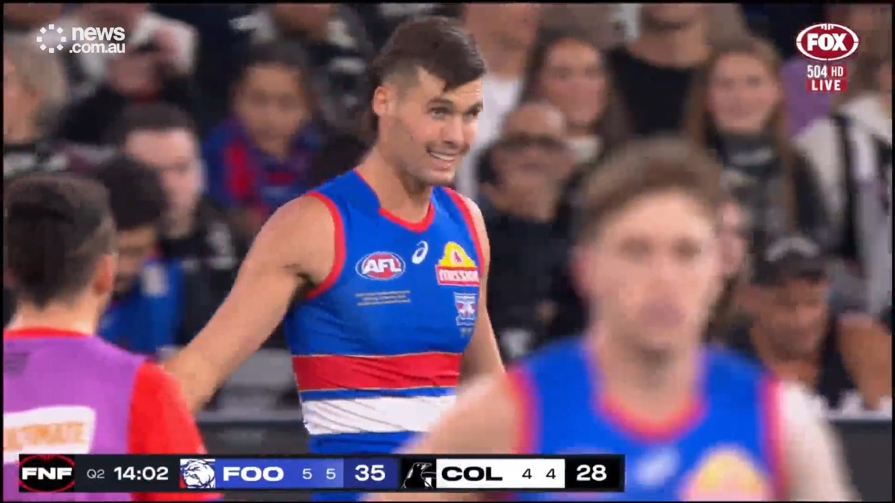 Luke Darcy watches on as son Sam dominates on MCG