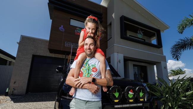 Burpengary East resident David Strickland with daughter Piper. Mr Strickland has cancelled his hugely popular Christmas light display after complaints. Picture Lachie Millard