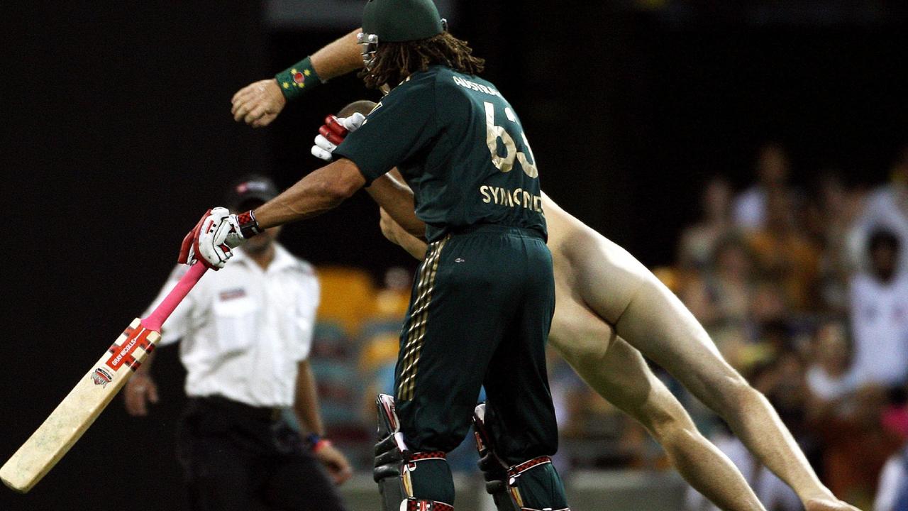 Australia's Andrew Symonds (front) clashes with a streaker in 2008. Picture: AFP Photo/Greg Wood