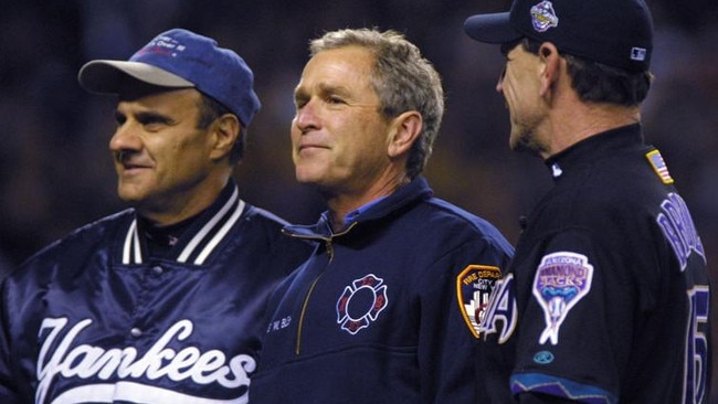 President George W. Bush talks with managers Joe Torre of the New York Yankees and Bob Brenly of the Arizona Diamondbacks Yankee Stadium. Picture: Al Bello/ALLSPORT