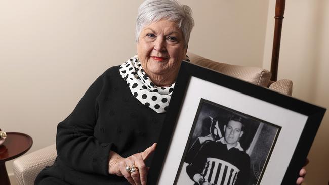 Libby Abley with a photo of her late husband and former Port Adelaide champion John Abley. Picture: Sarah Reed