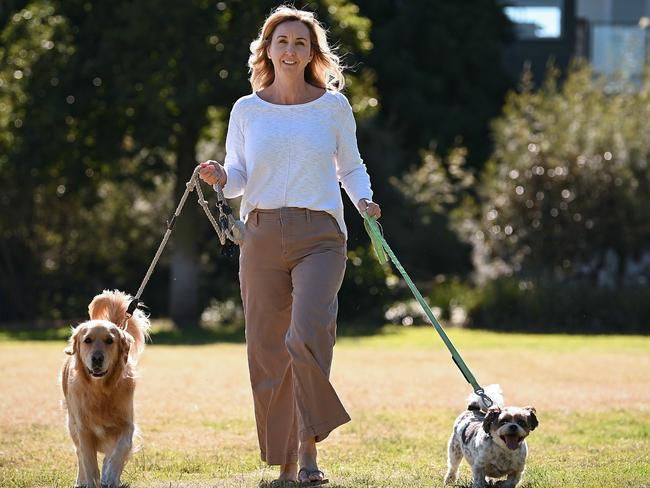 Jenny Parnham with dogs Oscar (left) and Alfie at their dog park in Brisbane’s Bulimba. Picture: Lyndon Mechielsen