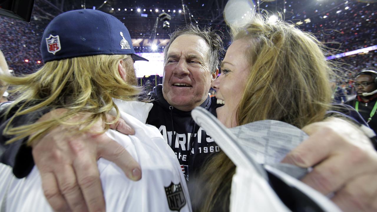 ADDS ID OF BELICHICK'S CHILDREN - New England Patriots head coach Bill Belichick, center, celebrates with his son Steve Belichick, left, and daughter Amanda Belichick after NFL Super Bowl XLIX football game against the Seattle Seahawks Sunday, Feb. 1, 2015, in Glendale, Ariz. The Patriots won 28-24. (AP Photo/Matt Slocum)