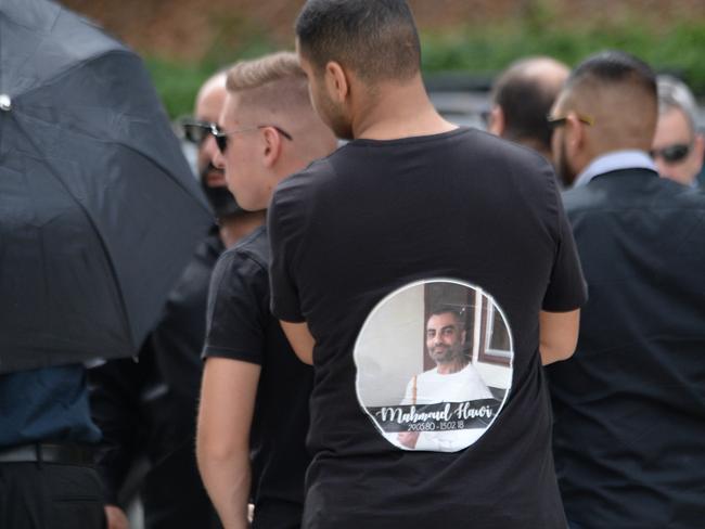 A mourner at Mahmoud Hawi’s funeral wears a special T-shirt. Picture: Jeremy Piper