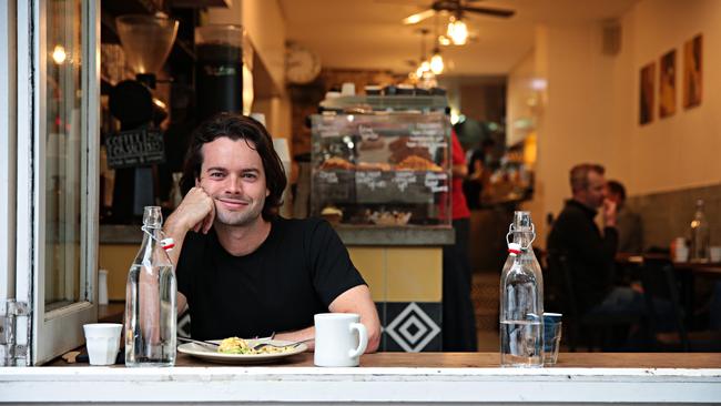 Johnny Ellice-Flint eating breakfast on Crown St Surry Hills on NSW's Freedom day. Picture: NCA NewsWire / Adam Yip