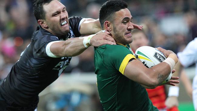 Kangaroos winger Valentine Holmes proves a handful for Kiwis rival Jordan Ropana. Picture: AAP