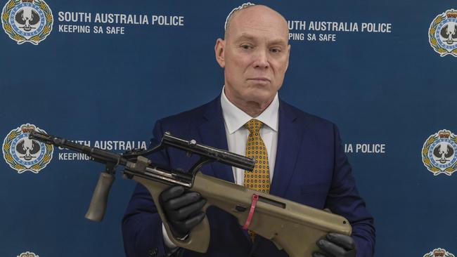 Detective Chief Superintendent Steve Taylor, former officer-in-charge of the Serious and Organised Crime Investigation Branch holding a high powered firearm seized as part of Operation Ironside. Picture: Roy Van Der Vegt