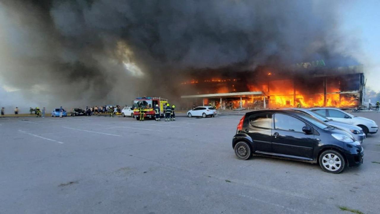 Firefighters putting out the fire in a mall hit by a Russian missile strike in the eastern Ukrainian city of Kremenchuk. Picture: AFP