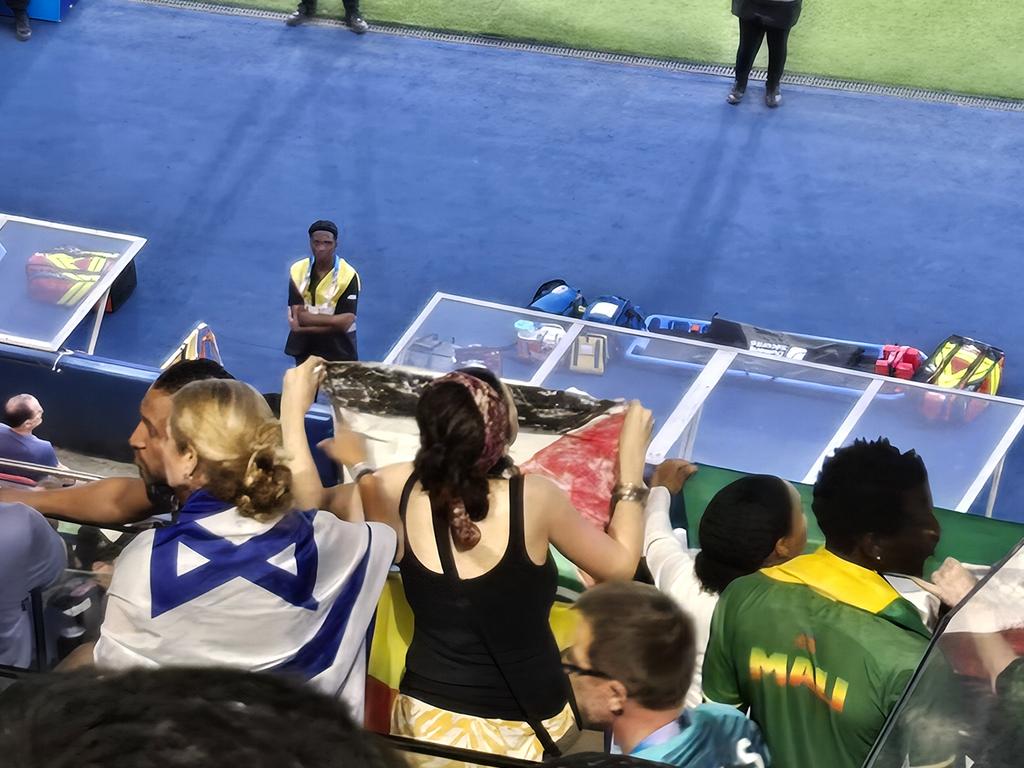 Israeli and pro-Palestinian spectators were situated just one row behind each other.