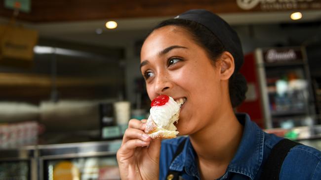 Shirani Fernando at Daniel's Donuts in Springvale trying its vegan range. Picture: Penny Stephens