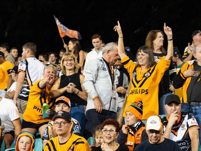 Tigers fans celebrate their teams win over the Sharks. Photo: Tom Parrish