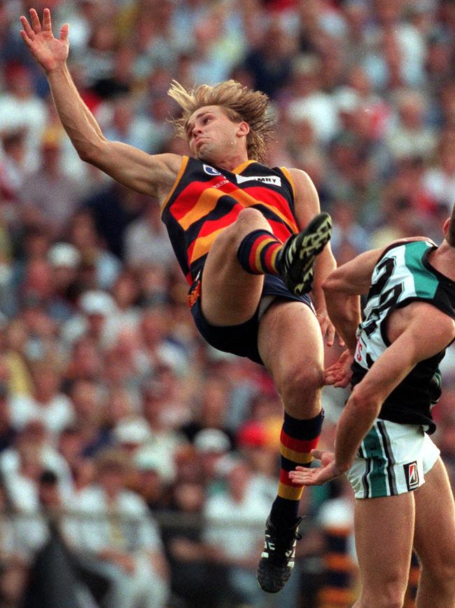 Modra looks on as the ball flies out of reach.