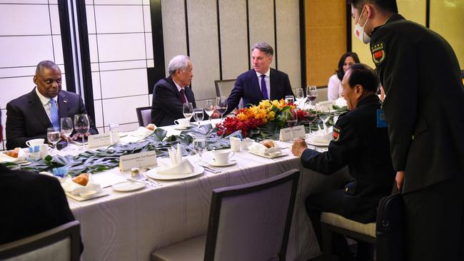 Australia's Defence Minister Richard Marles, centre, shakes hands with Singapore's Defence Minister Ng Eng Hen as China's Defence Minister Wei Fenghe, right, talks to US Defencc Secretary Lloyd Austin, left. Picture: AFP