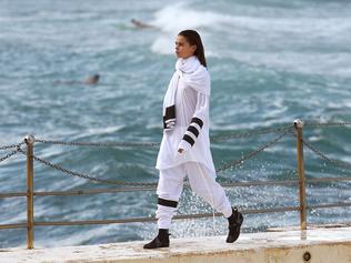 A model parades an outfit by fashion label Tenpieces at Bondi Beach during Fashion Week Australia in Sydney on April 16, 2015. AFP PHOTO / William WEST