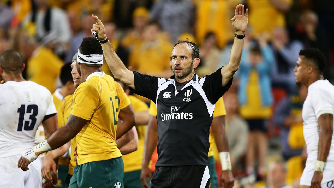 Referee Romain Poite calls for the TMO in a Test between Australia and England.