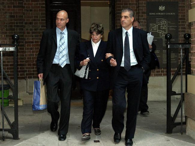 Nitzan Ronen (bald), Ida Ronen (female) and Izhar Ronen leave the Supreme Court in 2004 where they were facing tax evasion charges. Picture: Todd Martyn-Jones